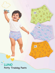 Baby jumping in light purple LUNO potty training pants next to three alternative patterned pairs.