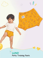 Toddler in yellow animal print LUNO potty training pants alongside a matching flat product view.