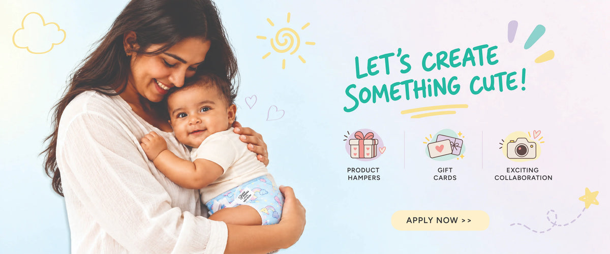 Mother holding baby in rainbow LUNO training pants under Let’s Create Something Cute text.