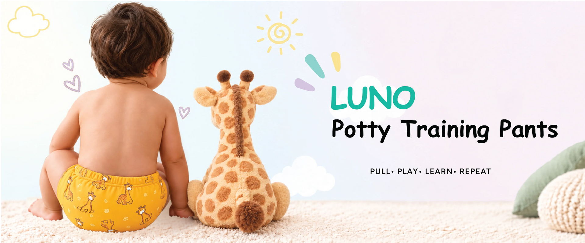 Toddler in yellow giraffe print LUNO potty training pants sitting next to a plush giraffe toy
