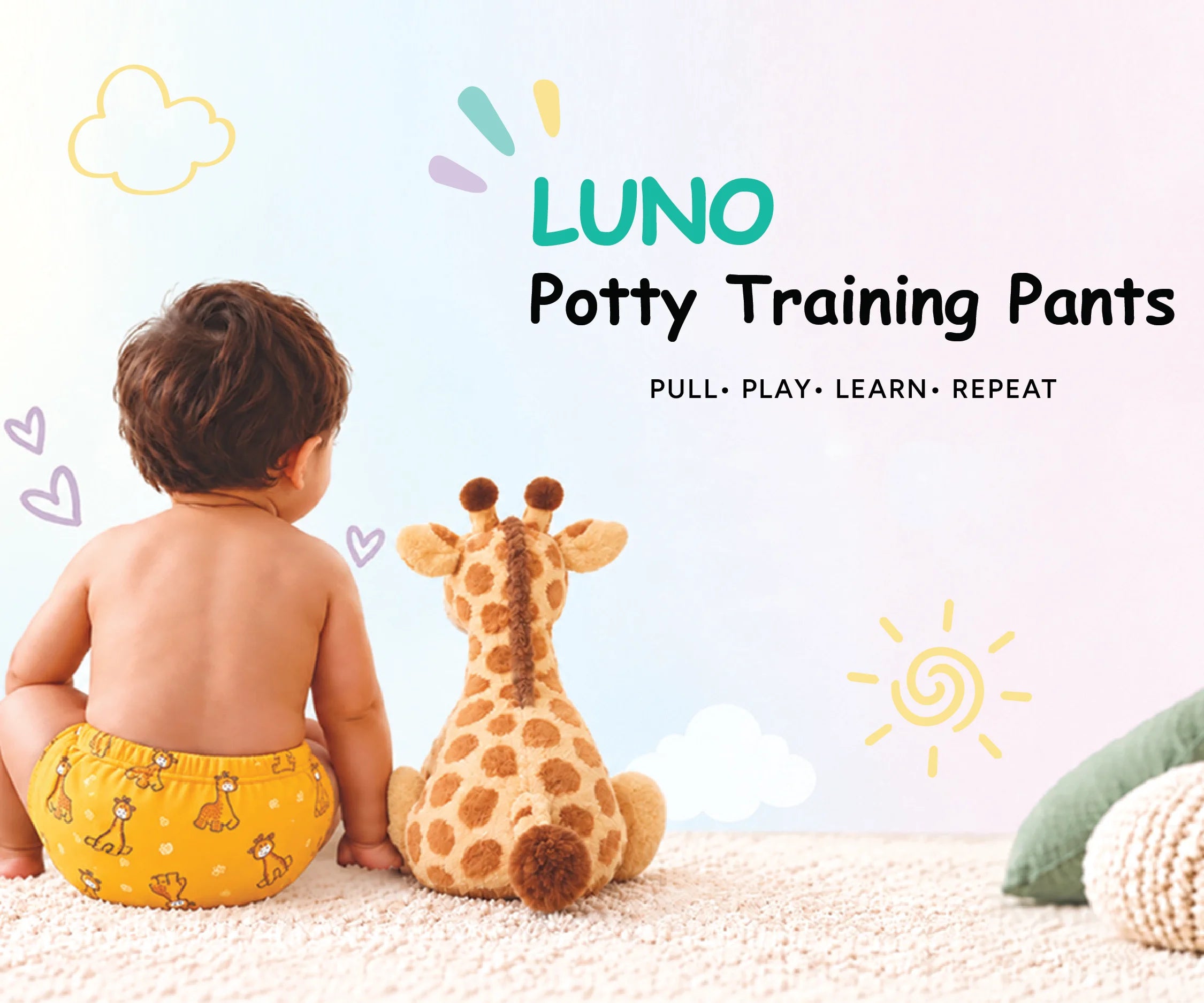 Toddler in yellow giraffe print LUNO potty training pants sitting next to a plush giraffe toy