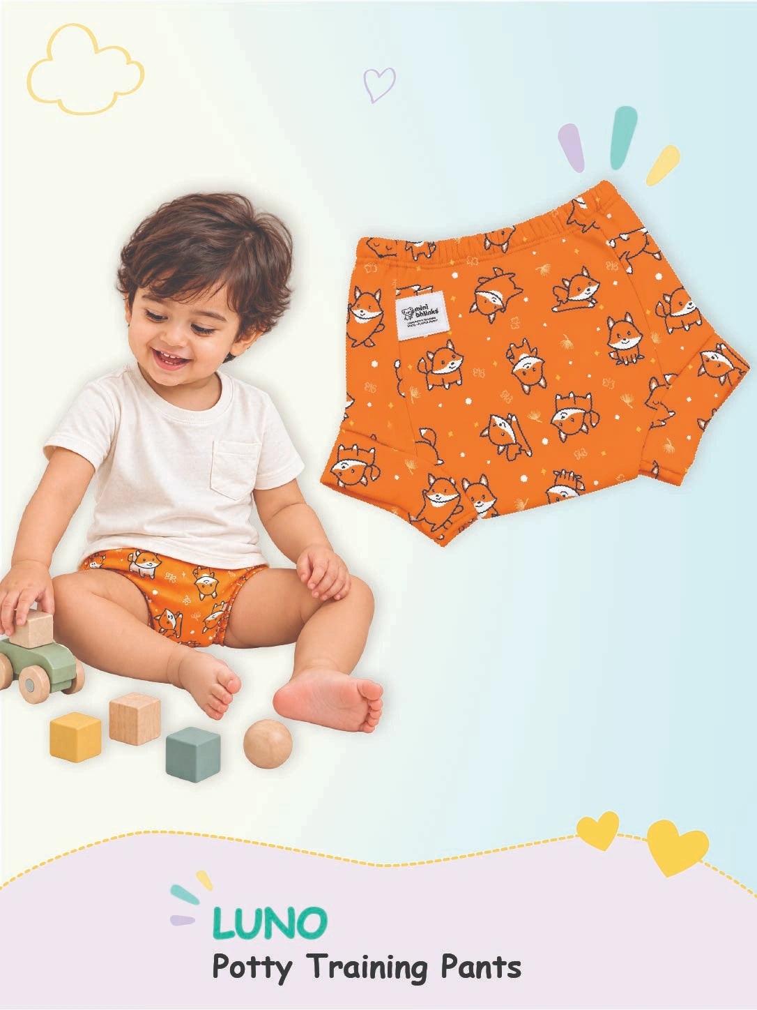 Toddler playing in Puppy print orange LUNO potty training pants alongside a flat product view.