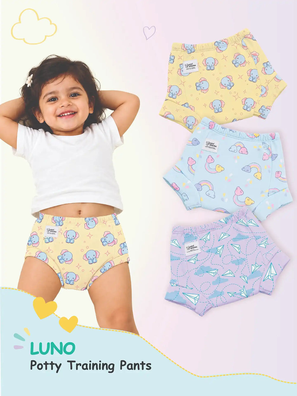 Smiling child in elephant print yellow LUNO potty training pants next to yellow, blue, and lavender pairs.